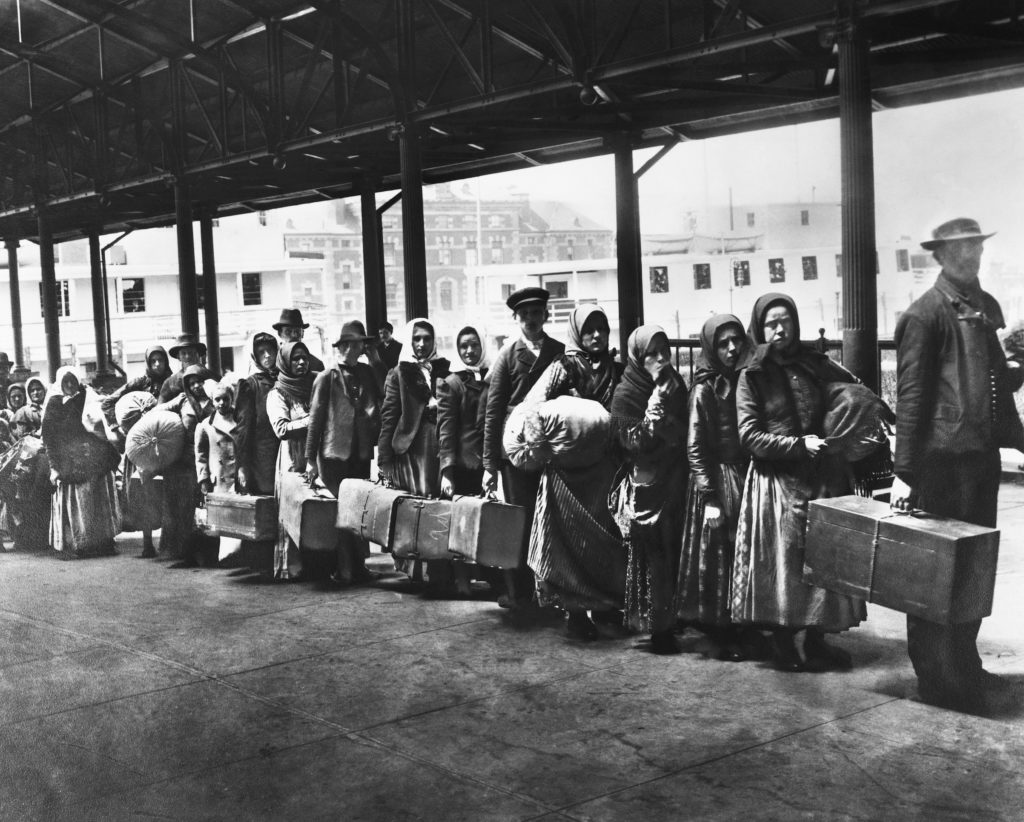 Queue of immigrants to America, c 1900